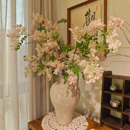 Artificial locust blossom branch with clustered small blooms, light pink color
