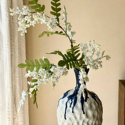 Artificial locust blossom branch with clustered small blooms